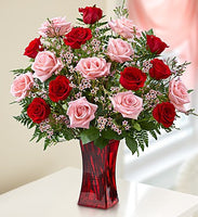 Red and pink roses in a red vase for same day fresh flowers delivery by local florist near Livermore,Pleasanton , Dublin