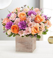 alstroemerias and peach roses with lavender carnations