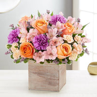 alstroemerias and peach roses with lavender carnations