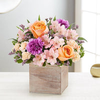 alstroemerias and peach roses with lavender carnations