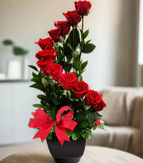 Dozen red roses in a spiral shape in a black ceramic container same day fresh flowers delivery by local florist near Livermore,Pleasanton , Dublin
