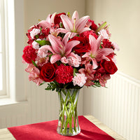 Pink lilies with red roses , red carnations and pink alstroemerias same day fresh flowers delivery by local florist near Livermore,Pleasanton , Dublin