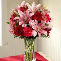 Pink lilies with red roses , red carnations and pink alstroemerias same day fresh flowers delivery by local florist near Livermore,Pleasanton , Dublin