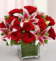
              Red roses with stargazers in a glass cube vase for same day fresh flowers delivery by local florist near Livermore,Pleasanton , Dublin
            