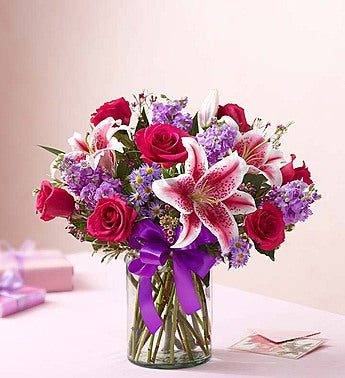 Hot pink roses with stargazers, stock and purple fillers Same day flowers delivery by local florist near Livermore, Pleasanton, Dublin