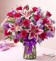 
              Hot pink roses with stargazers, purple stock and purple fillers Same day flowers delivery by local florist near Livermore, Pleasanton, Dublin
            