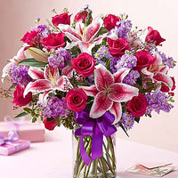 Hot pink roses with stargazers, purple stock and purple fillers Same day flowers delivery by local florist near Livermore, Pleasanton, Dublin