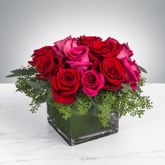 Red and hot pink roses in a cube vase for same day fresh flowers delivery by local florist near Livermore,Pleasanton , Dublin