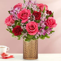 hot pink roses, red carnations and alstroemerias with pink fillers