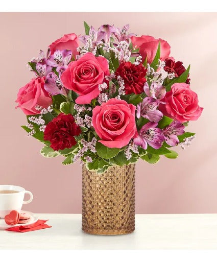 hot pink roses, red carnations and alstroemerias with pink fillers
